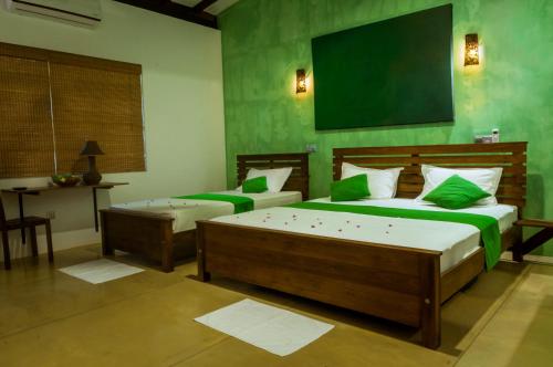 Lova arba lovos apgyvendinimo įstaigoje Hotel Garcinia Leaf