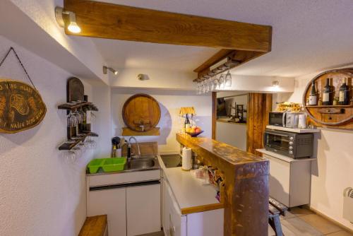 a kitchen with a sink and a counter top at Kuca za odmor Vinica breg in Varaždin