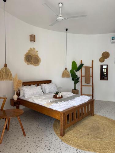 a bedroom with a large bed in a room at Jumbo Resort in Paje