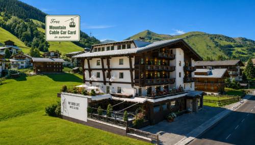 an aerial view of a hotel in the mountains at MyGoodLife Hotel & Bar in Gerlos