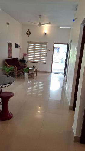 a living room with a couch and a table at Purayilhomestay in Varkala