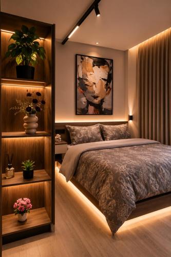 a bedroom with a bed and a shelf with plants at هابي رومز - شقق فندقية في الخبر in Al Khobar