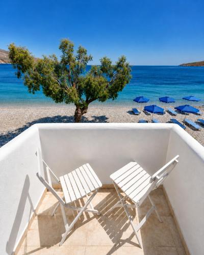 two chairs and umbrellas on the beach at Dream Island Hotel in Livadia
