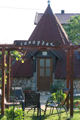 a group of chairs in front of a building at Seosko domaćinstvo Peković in Danilovgrad