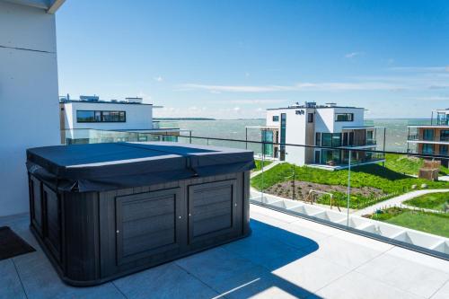 a view of the ocean from the balcony of a building at MarienHome Loojangu in Haapsalu