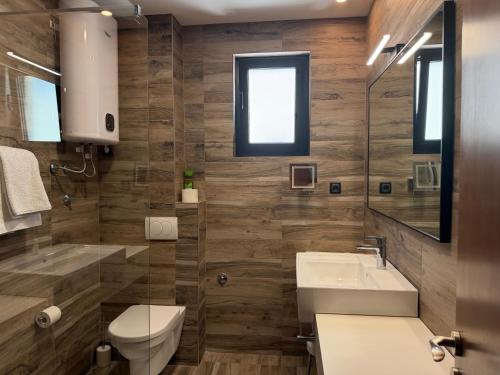 a bathroom with a toilet and a sink at Eluize Inn Dubrovnik in Dubrovnik