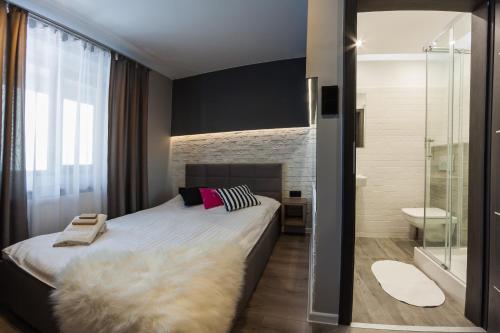 Łóżko lub łóżka w pokoju w obiekcie Hotel Oaza
