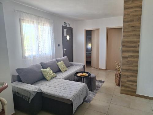 a living room with a couch and a table at 4 you in Nin