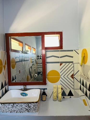 a bathroom with a sink and a mirror at Amber Koh Rong in Koh Rong Island