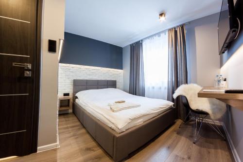 Łóżko lub łóżka w pokoju w obiekcie Hotel Oaza