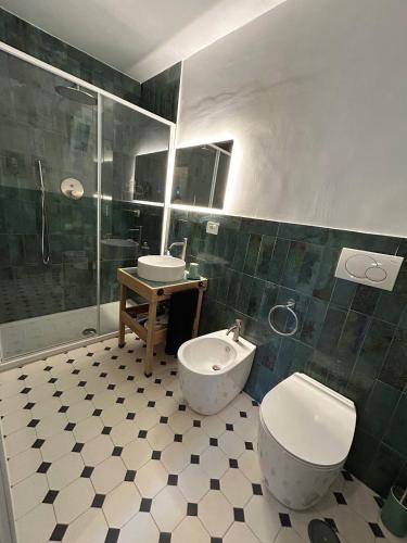 a bathroom with a toilet and a sink at Casa Elisabetta in Tuscania