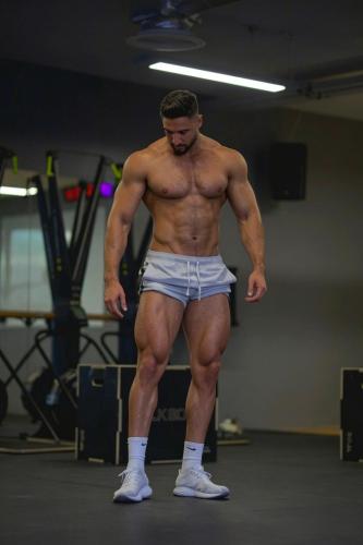 a shirtless man standing in a gym with his torsoearchangering at Private Room with King Size Bed, TV and Shared Bathroom in London
