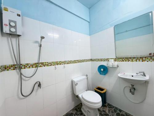 a bathroom with a toilet and a sink at J Home in Ao Nang Beach