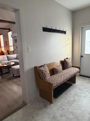 a living room with a couch in the corner at A Stay Across The Bay in Curling