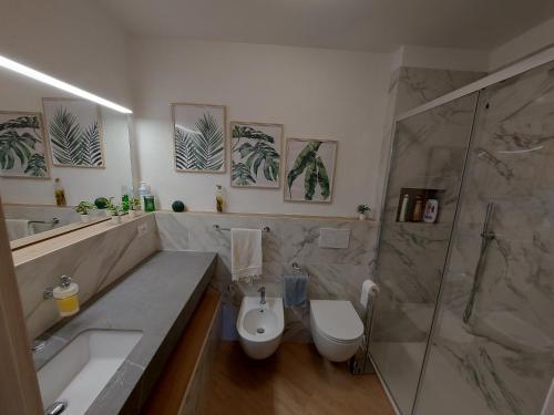 a bathroom with a sink and a toilet and a shower at Vicolo dell'Orto in Montaione