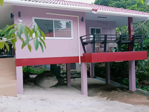 a small house with a red and white at Elevated Bungalow House 3-11 in Nathon Bay