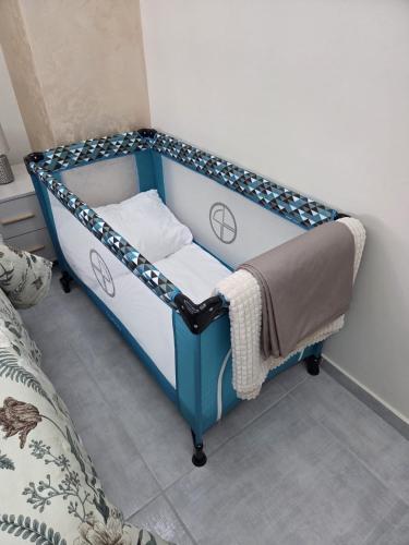 a blue and white bunk bed in a room at Golden Time SM Apartman in Sremska Mitrovica