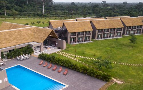 an aerial view of a resort with a swimming pool at Bon Hotel Crown Forest in Nsuaem
