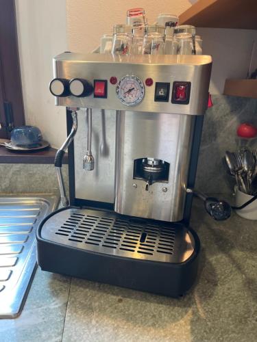 a coffee maker is sitting on a counter at Il Sentiero dei Goti San Marino e Montefeltro in Monte Grimano Terme