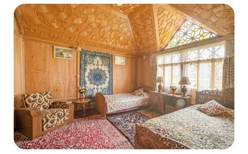 a bedroom with two beds and a window at The Martin's Houseboat in Srinagar