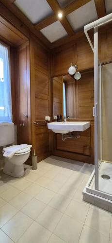 a bathroom with a sink and a toilet at Appartamento La Torre in Lenno