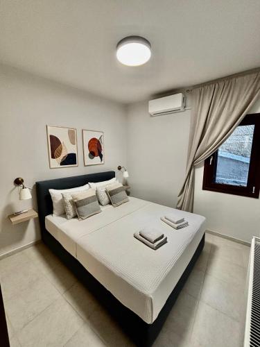 a bedroom with a large bed in a room at Pelion PNOES Luxury Seaview Villa with priv Garden in Káto Lekhónia