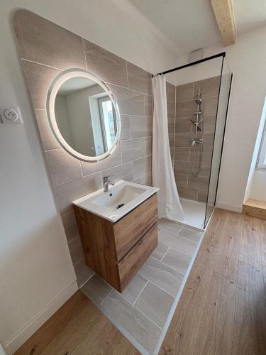 a bathroom with a sink and a shower at Maison de vacance à DAX in Dax