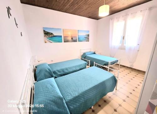 a bedroom with two beds in a room at La Casetta in Sarroch