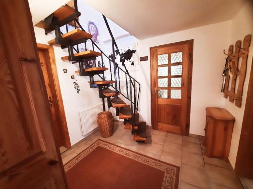 a hallway with a spiral staircase in a house at Ferienhaus in Gera
