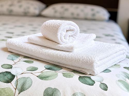 a couple of towels sitting on top of a bed at Milano Brenta Suites Room for 4 in Milan
