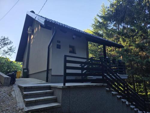 a building with stairs leading up to a house at Forest Magic in Duga Resa