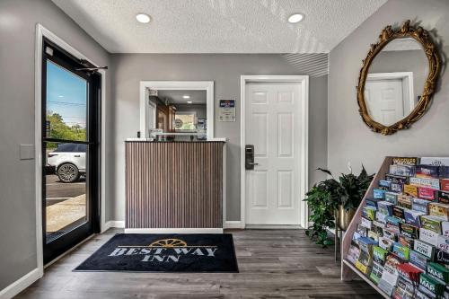 a front door of a store with a sign that says the best way inn at Best Way Inn in Middlefield