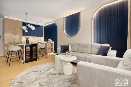 a living room with a couch and a table at Apartament POGO LOVERS in Pogorzelica