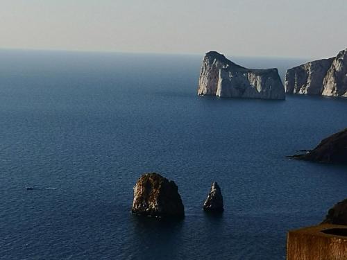 two large rocks in the middle of the ocean at casa vacanze AG in Portoscuso