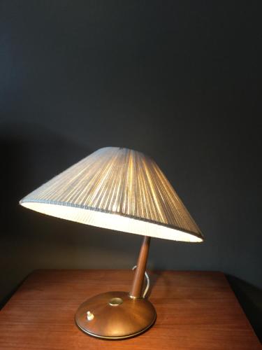 a lamp that is on top of a wooden table at Baeten's bed and breakfast in Ghent