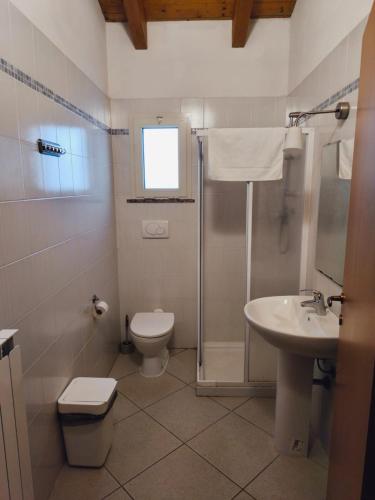 a bathroom with a toilet and a sink at Ostello di Montefiorino in Montefiorino