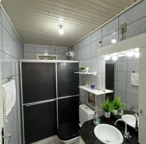 a bathroom with a sink and a toilet at Incantare in São Joaquim