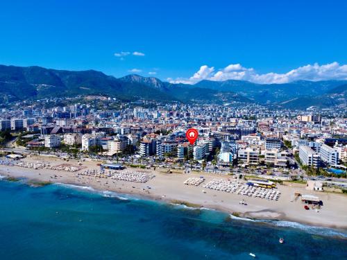 an aerial view of a beach and a city at SA Apartments! Beachfront Apartments in Oba in Alanya