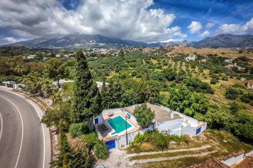 an overhead view of a house and a road at Dar Almaz in Mijas