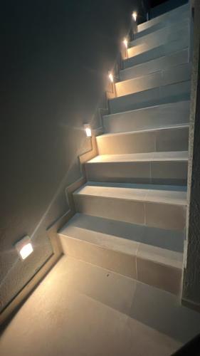 a stairway with lights on the side of it at Casa cidade Pedro II PI in Pedro II