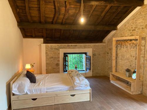 a bedroom with a large bed in a building at Casa Piedad in Allence