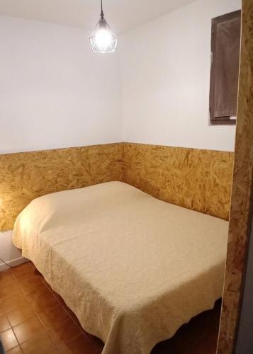 a small bedroom with a bed in a room at Appartement 200m plages in Six-Fours-les-Plages