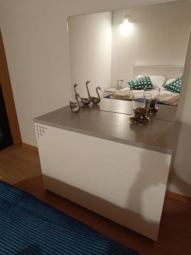 a white dresser in a room with a bed at Casa da Pinha in Ponte da Barca
