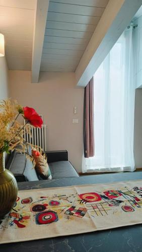 a bedroom with a bed with a rug on it at A casa di Anna in Cocconato