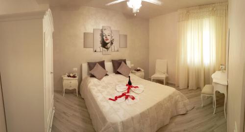 Кровать или кровати в номере La Rosa Del Garda Apartment