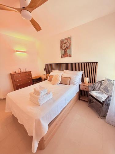 a bedroom with a large bed with a ceiling at Brisa Mediterránea Torrox Costa in Torrox Costa