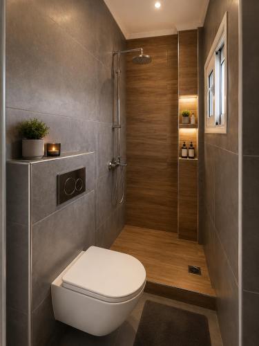 a bathroom with a toilet and a shower at Minimal Panorama Loutraki in Loutraki
