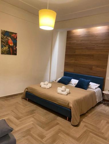 a bedroom with a bed with two towels on it at Maresia Apartment in Altavilla Milicia