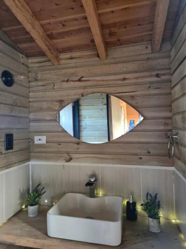 a bathroom with a white sink and a mirror at cabaña sol in Santa Elena