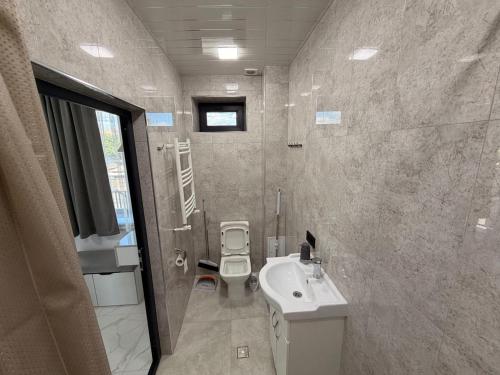 a bathroom with a toilet and a sink at MM House in Yerevan
